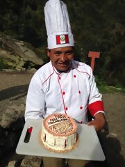 Our cook baking a cake